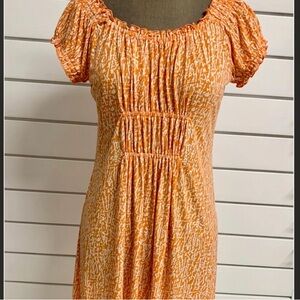 Michael Kors Orange Patterned Dress with gathering neck, arm, and waist line.